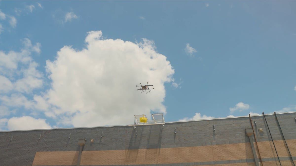 A drone flying over a warehouse.