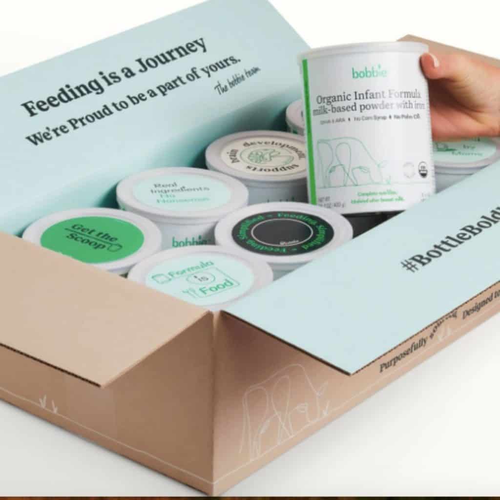 Box containing Bobbie infant formula cans.
