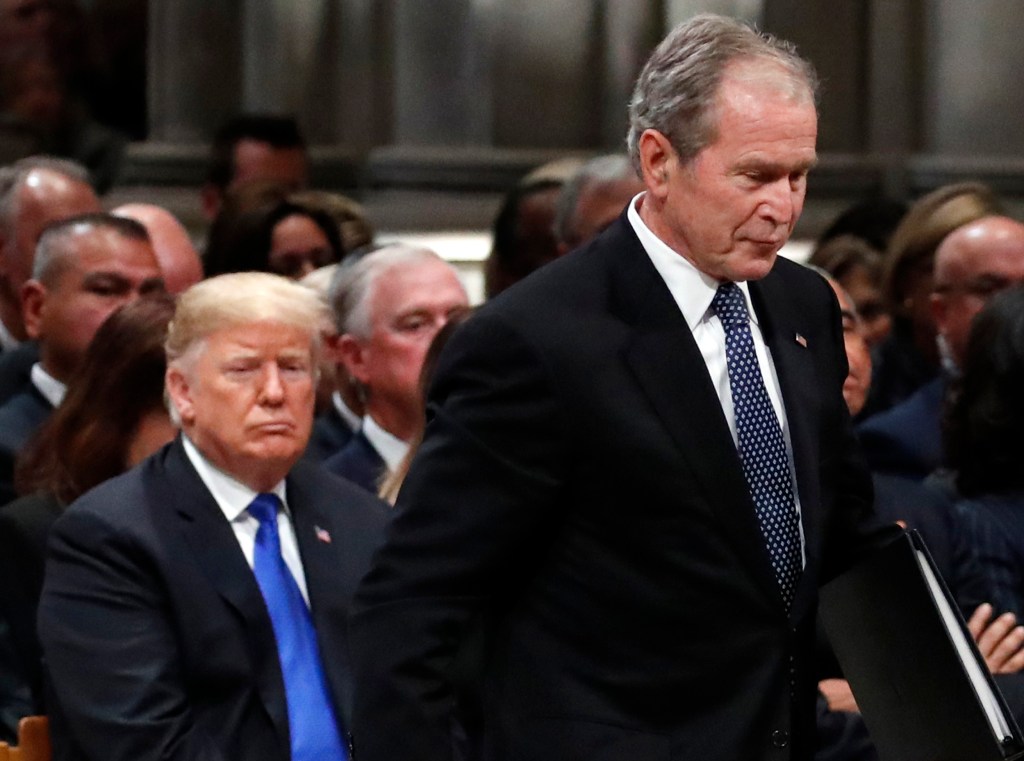 Former President George W. Bush walks past President Donald Trump to speak at the State Funeral for his father, former President George H.W. Bush, at the State Funeral at the National Cathedral, Wednesday, Dec. 5, 2018, in Washington. (AP Photo/Alex Brandon, Pool)