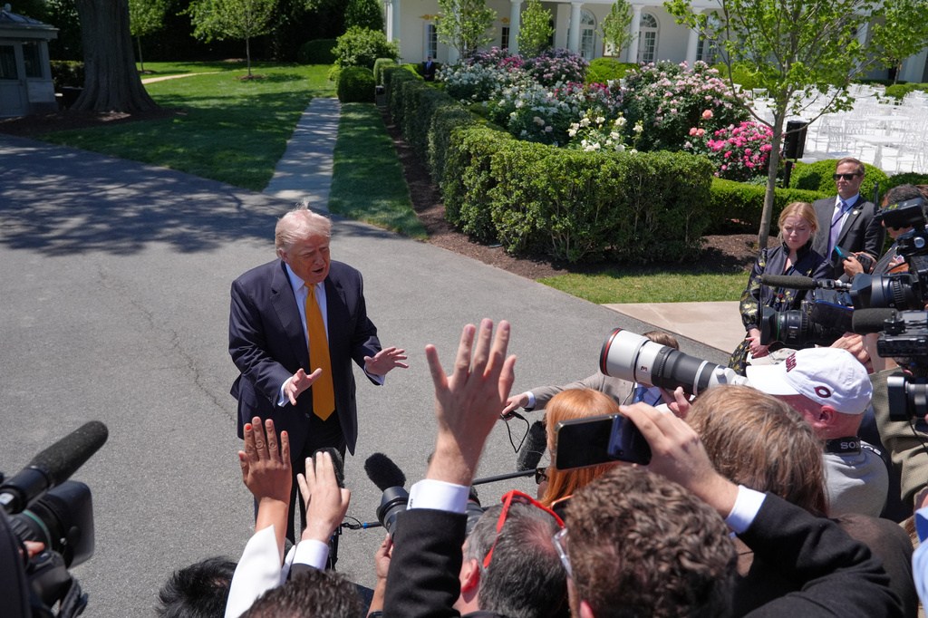President Donald Trump talks with reporters as he departs the White House for travel to Beijing, Tuesday, May 12, 2026, in Washington, to meet with China's President Xi Jinping. (AP Photo/Jacquelyn Martin)