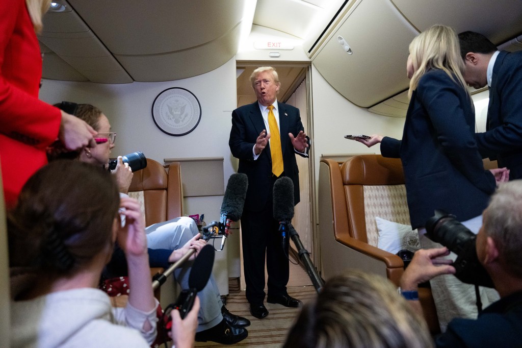 President Donald Trump speaks with reporters in flight on Air Force One after landing at U.S. Air Force Base at RAF Mildenhall, in Suffolk, Eastern England, Wednesday, July 8, 2026.