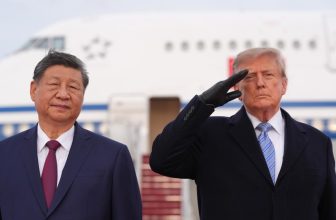 Trump winces during military flyover at Xi arrival ceremony