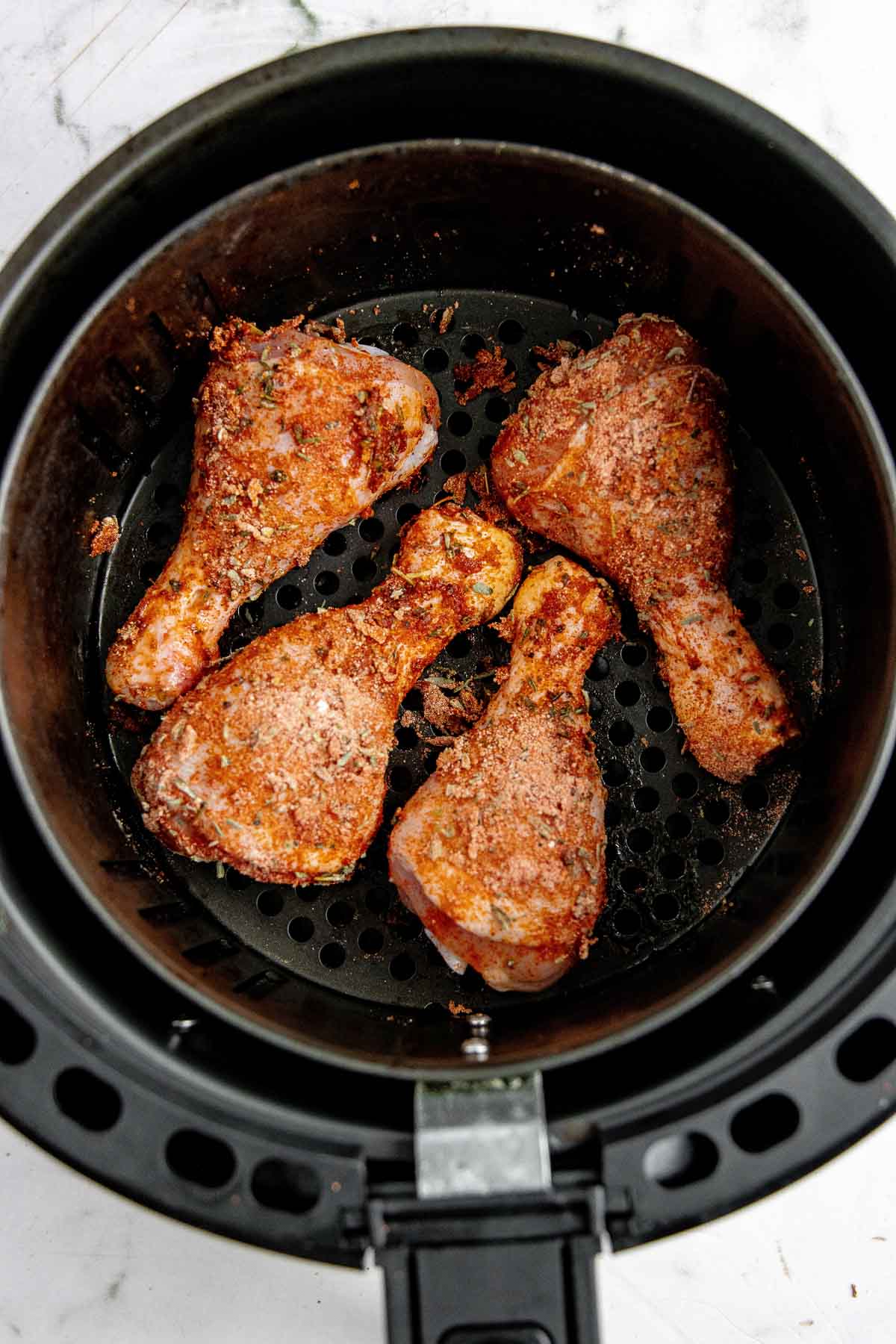 Chicken halfway through cook time before being flipped.