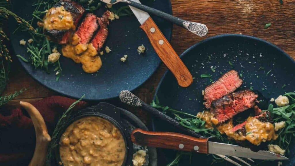 Steak with blue cheese sauce on top. 