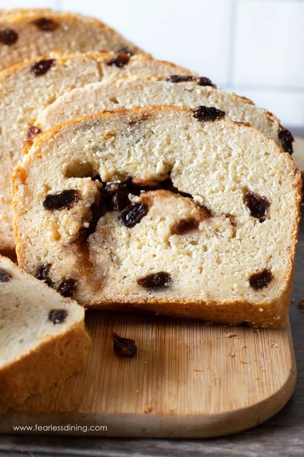 Easy Gluten-Free Cinnamon Bread from Fearless Dining. Sliced and laying on a cutting board.