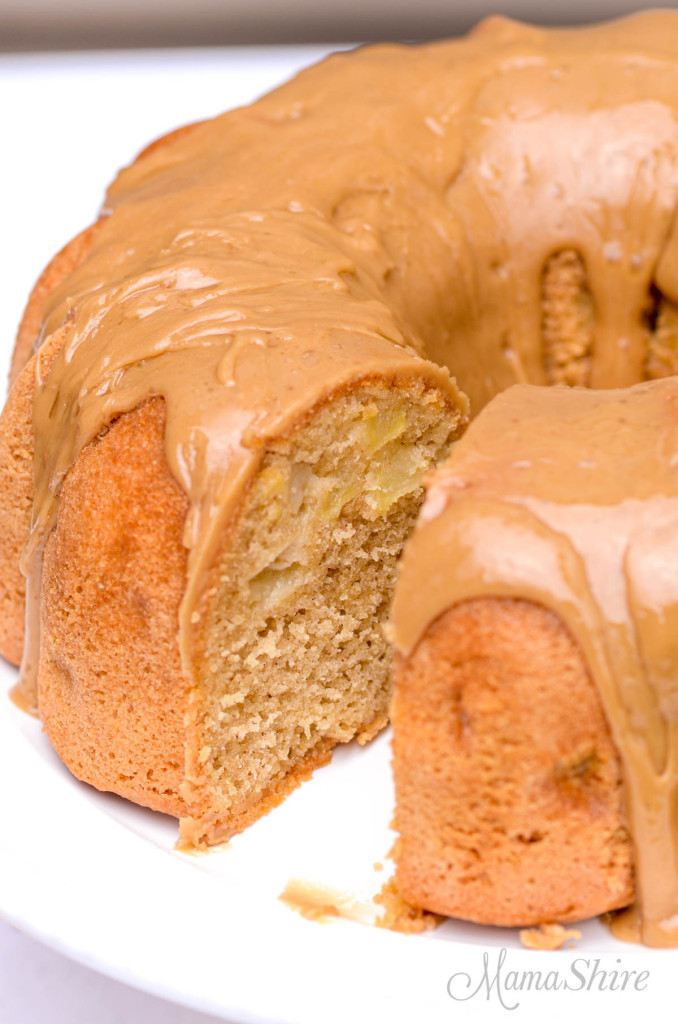 A slice of removed from a gluten-free apple bundt cake so you can see inside the cake.