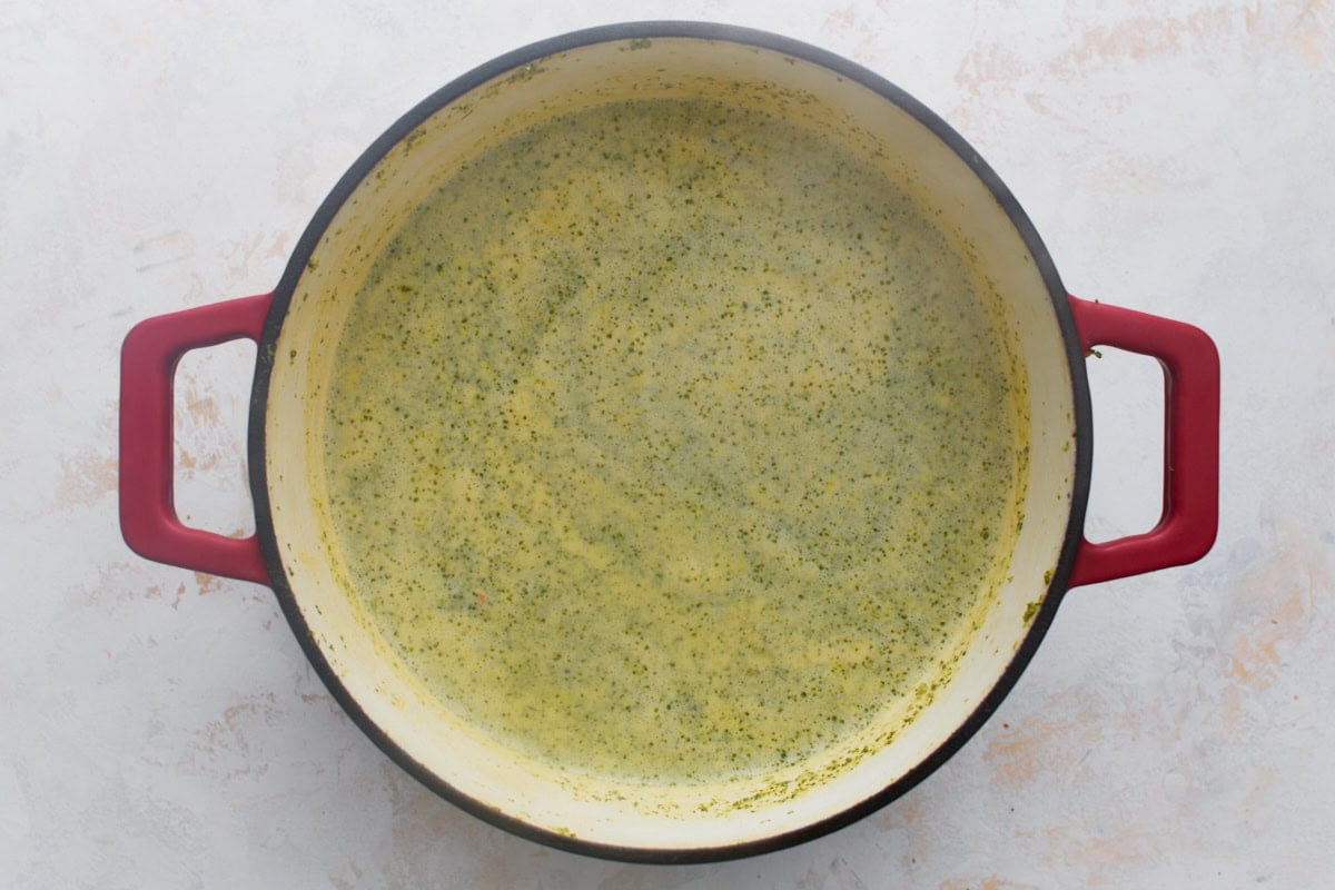 The soup turned a paler, speckled yellow-green after the half and half is stirred in, before it's thickened with the cornstarch slurry.