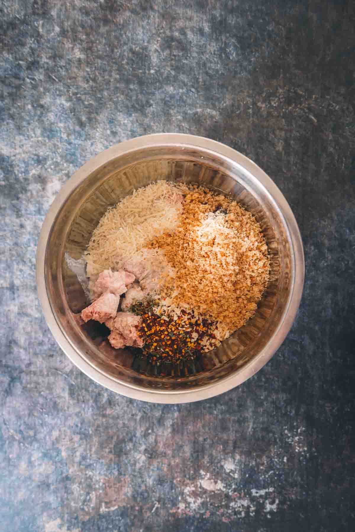 Meatball ingredients in a mixing bowl.