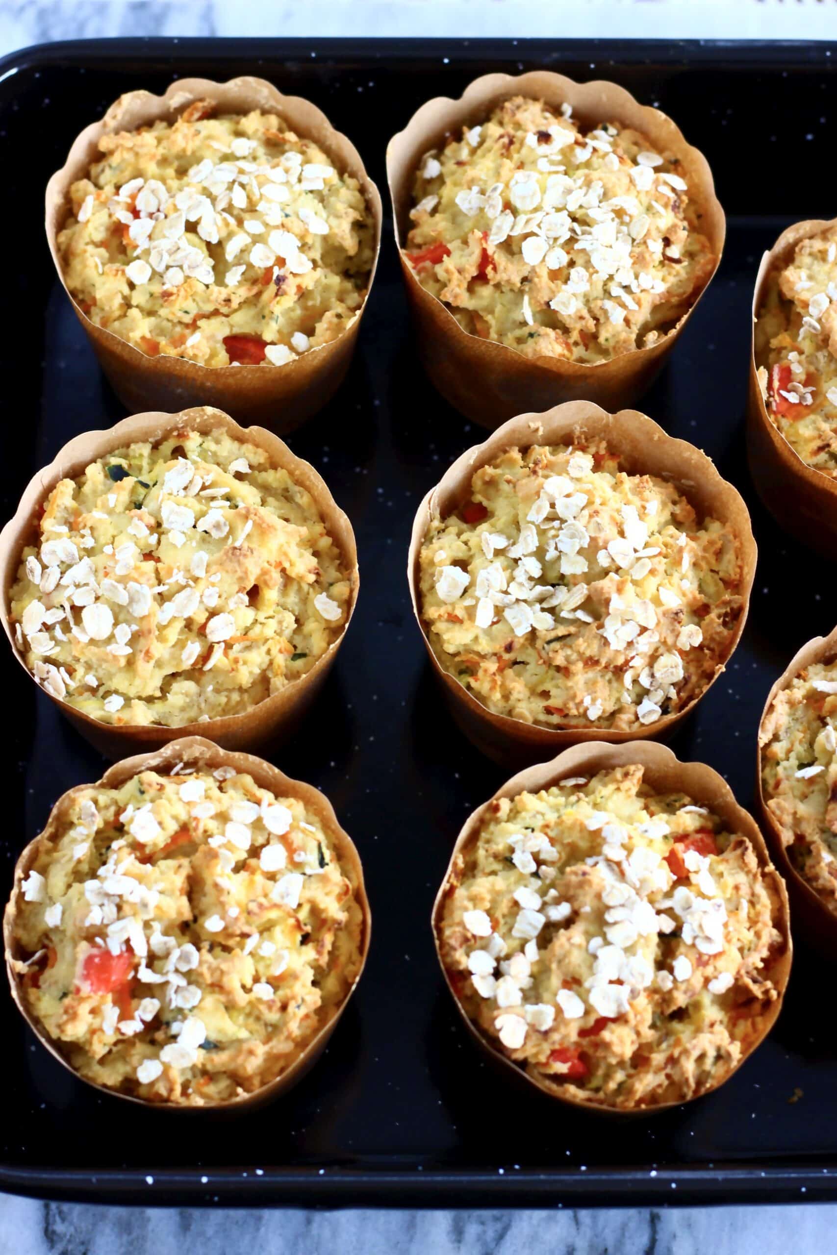 Six baked gluten-free vegan savoury vegetable muffins in a muffin tin