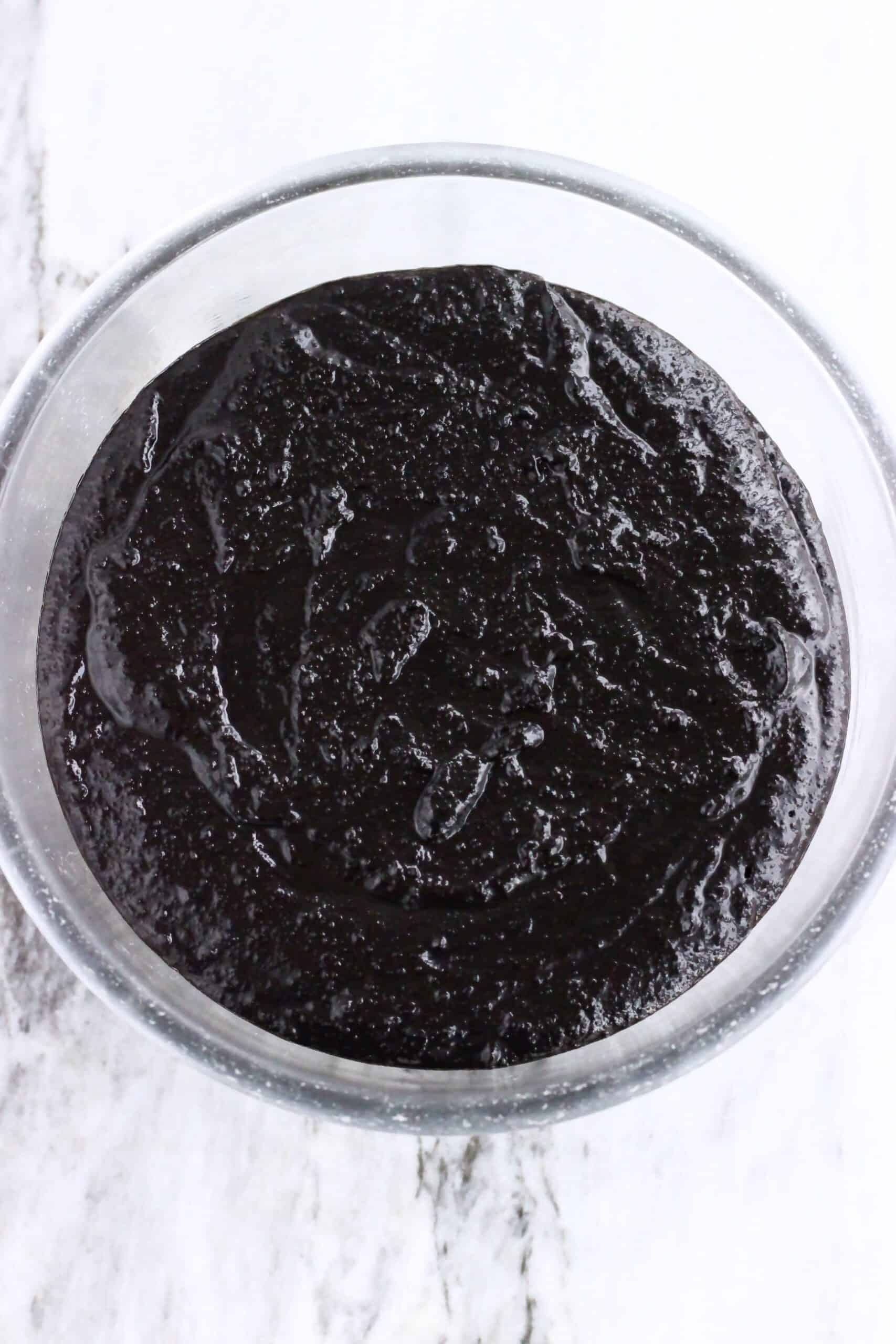 Raw vegan chocolate Christmas pudding batter in a glass bowl