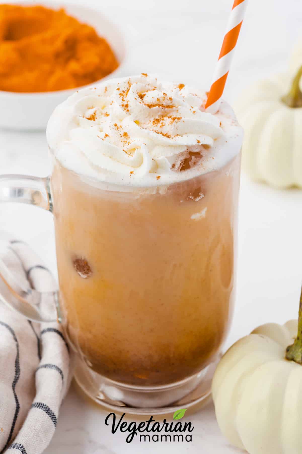 a pumpkin spice latte with whipped cream on top