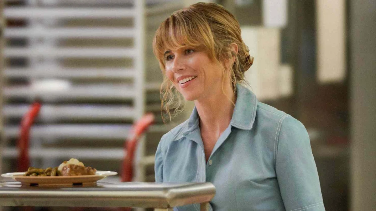 Linda Cardellini as Pamela Voorhees wearing the blue cable-knit sweater in Peacock's Crystal Lake