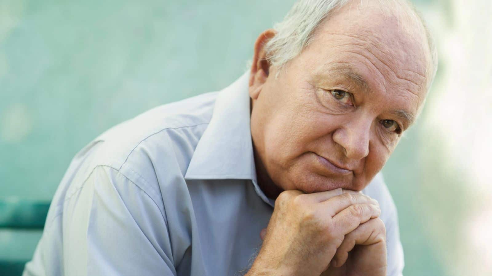 Portrait of sad bald senior man