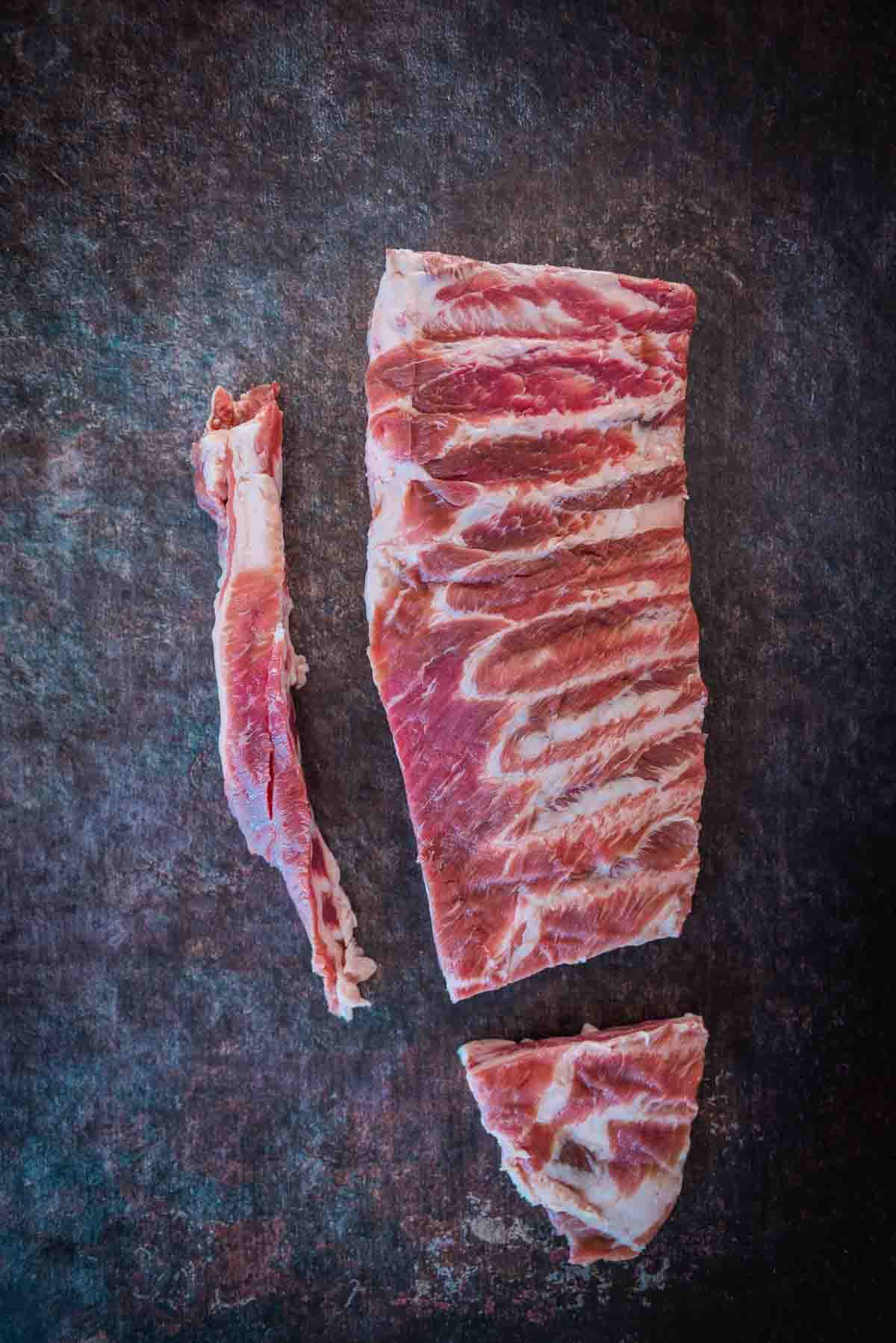 Rack of spare ribs, trimmed to show breast bone and flat meat removed.