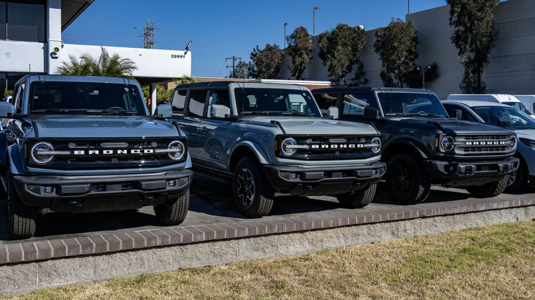 Three Ford Bronco SUVs parked next to each other.