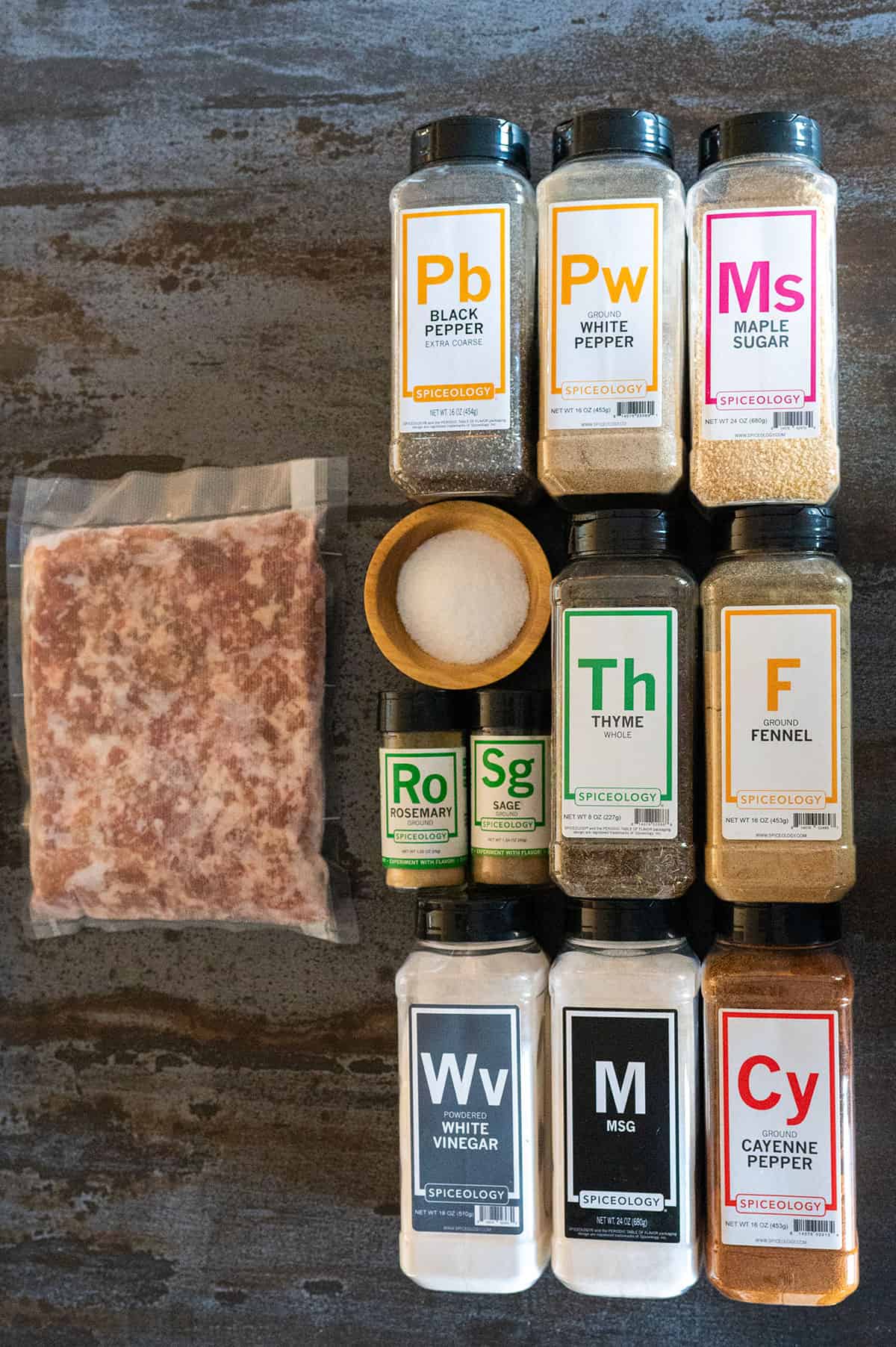 bottles of herbs and spices and ground pork.