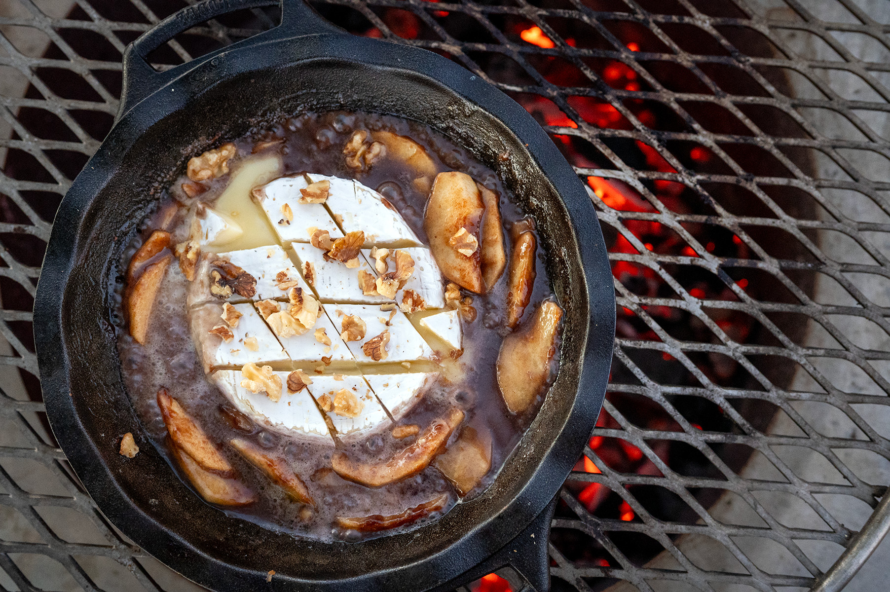 Brie melting in skillet with Apple Brie Dip.