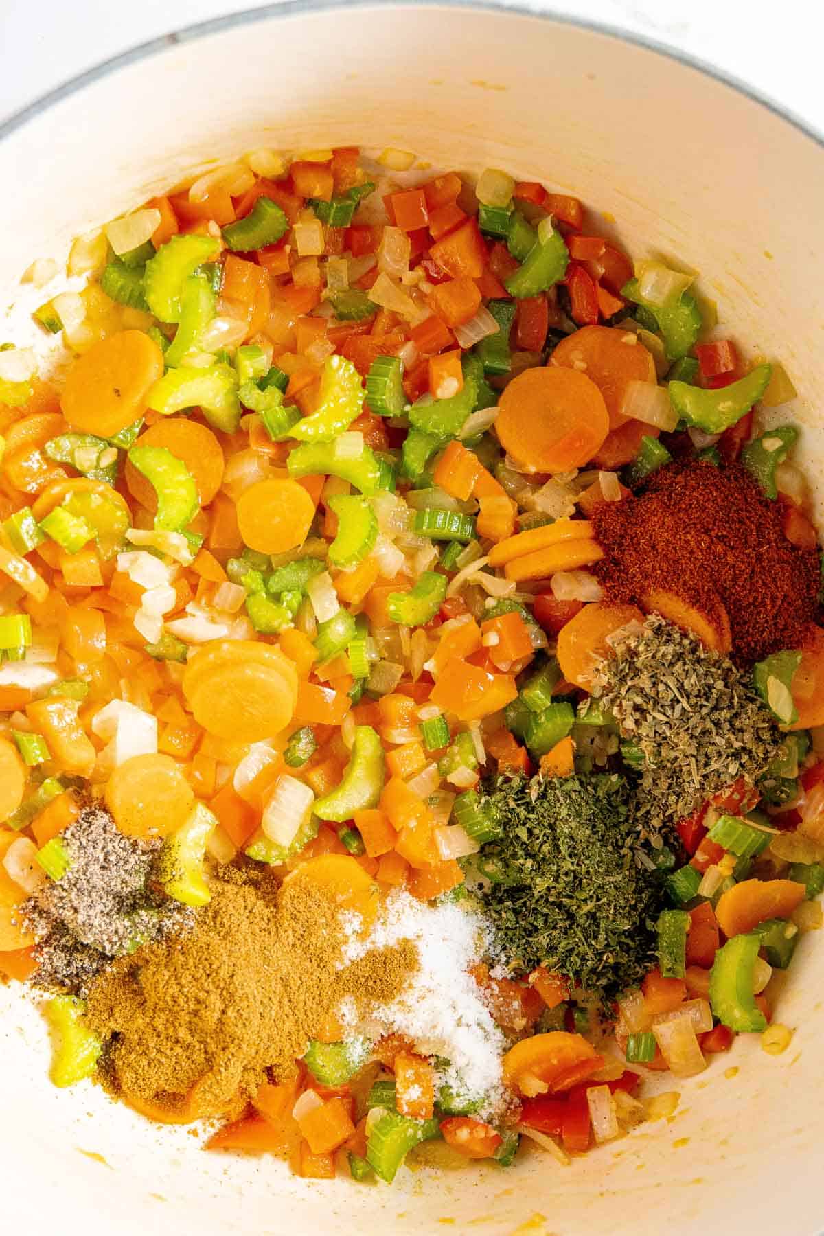 A pot filled with vegetables and spices.
