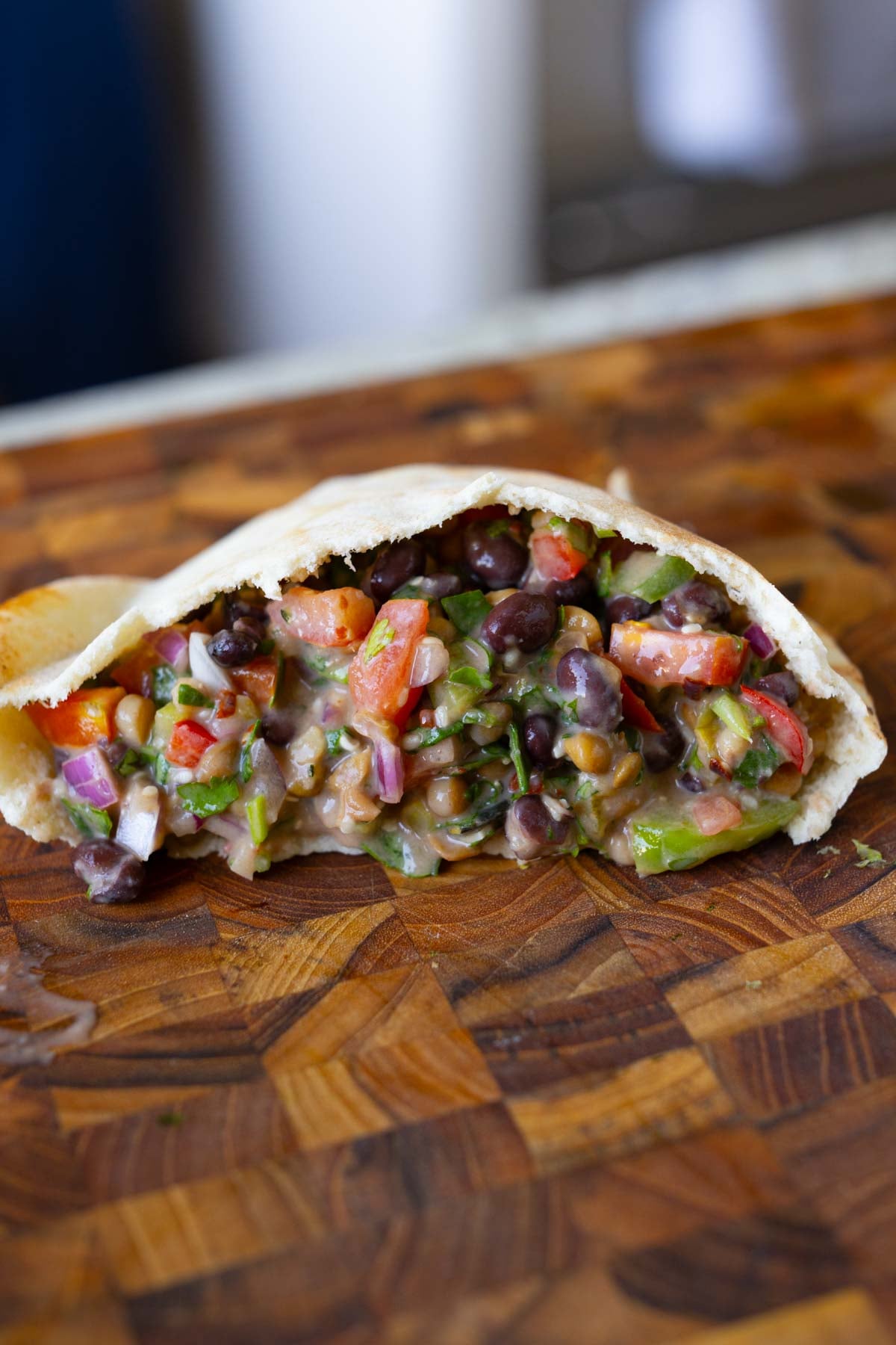 dense bean salad in a pita