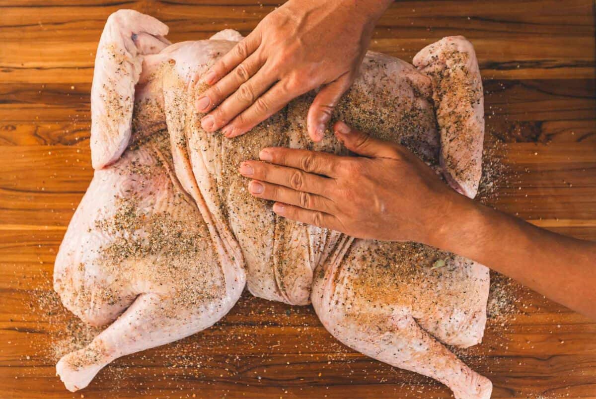 Hands rubbing brine into skin. 