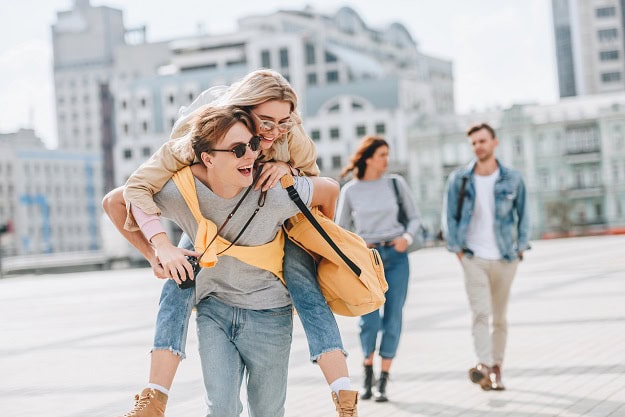 Friends outside having fun in a city area.