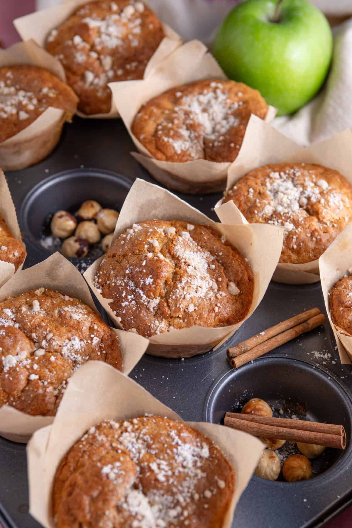 Gluten free apple muffins on a baking tray.