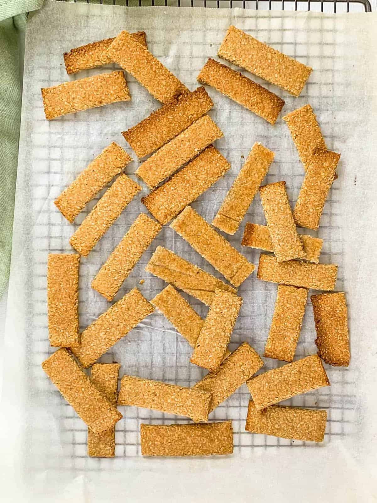 Homemade baby teething biscuits on a wire rack.