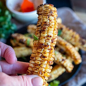 Holding Grilled Corn Ribs.