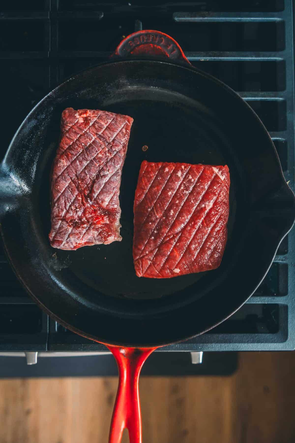 Blade steaks in a hot skillet.