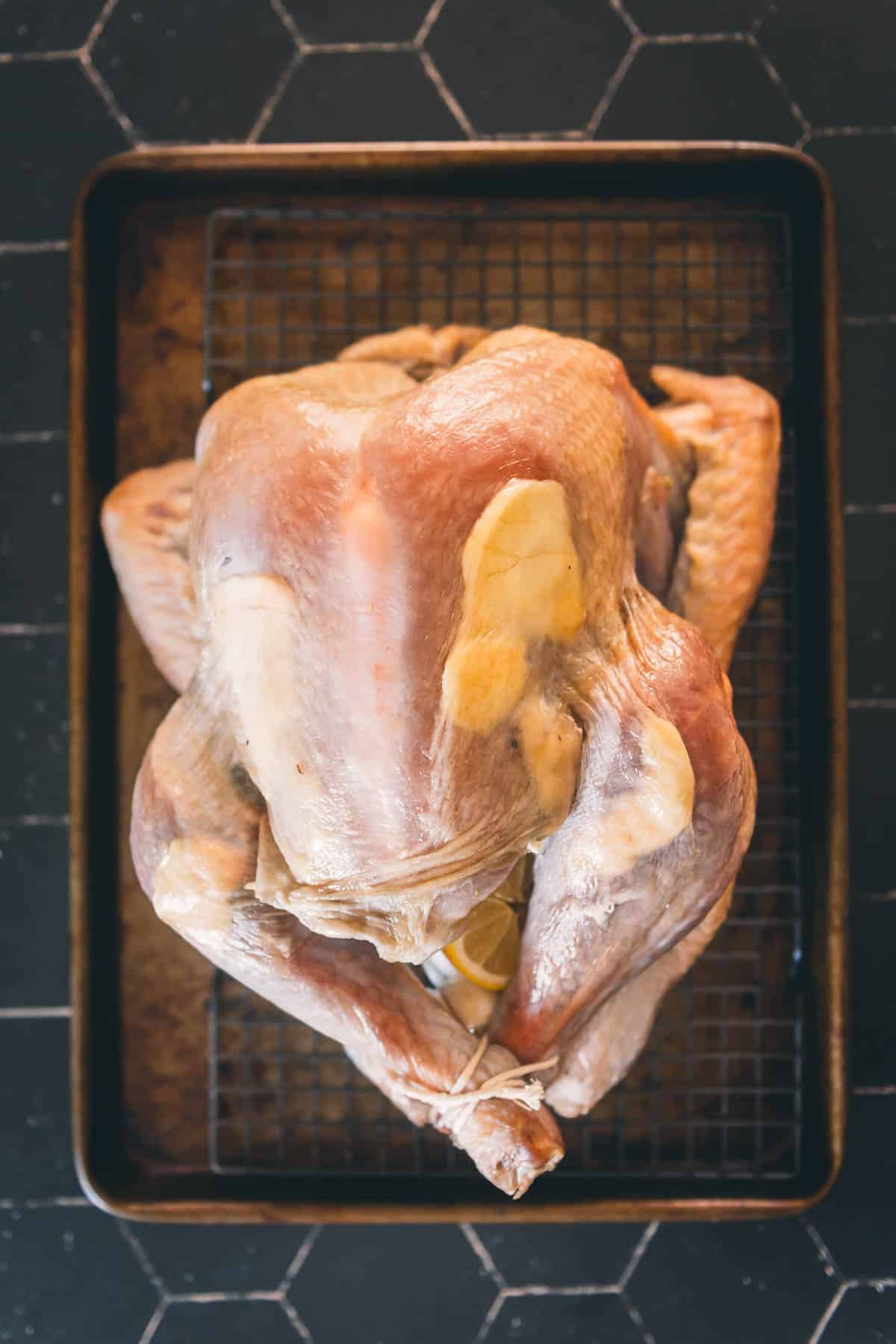 Soft butter placed under turkey skin.