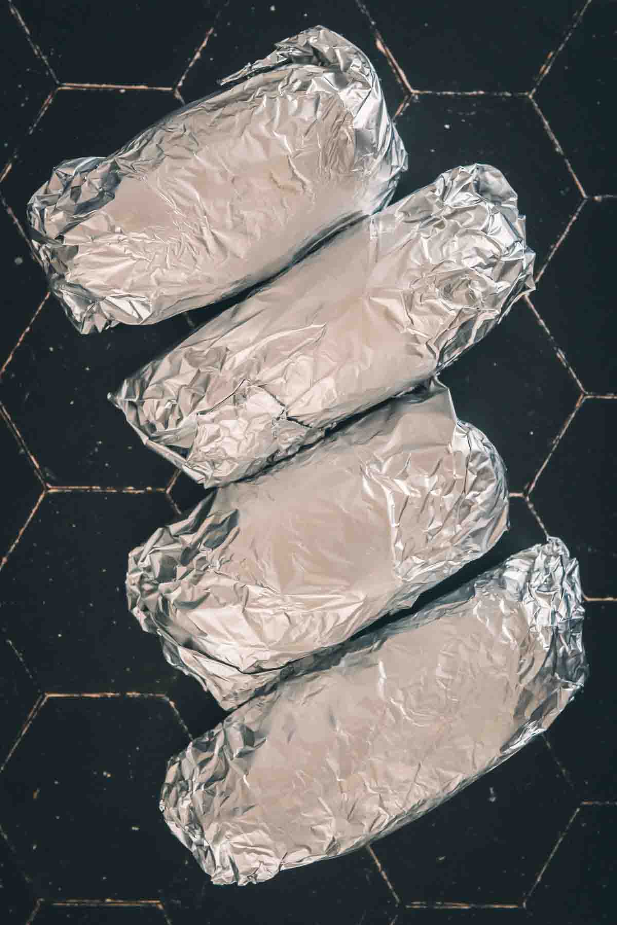 Potatoes wrapped in foil.