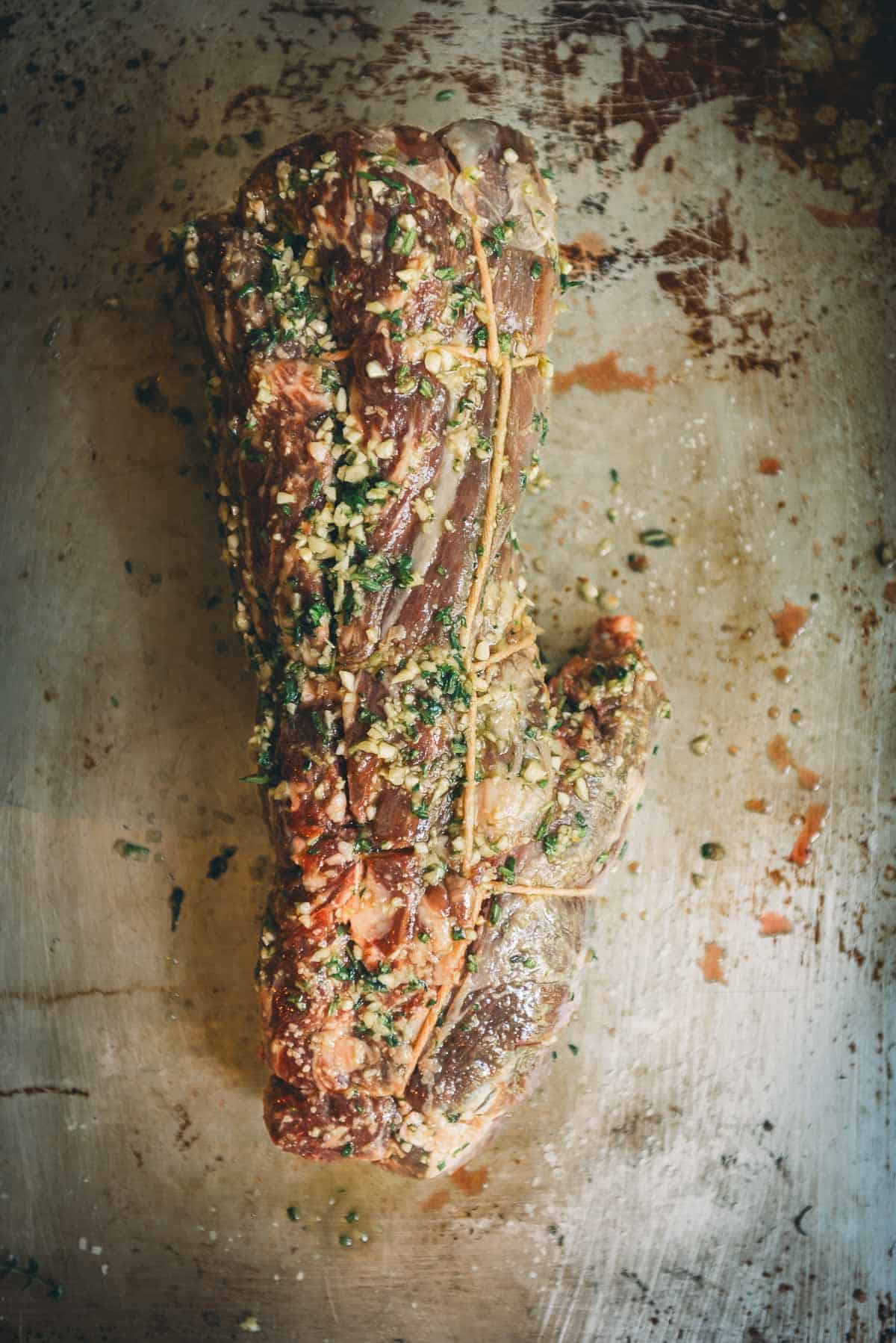 Beef tenderloin rubbed with the garlic herb paste.