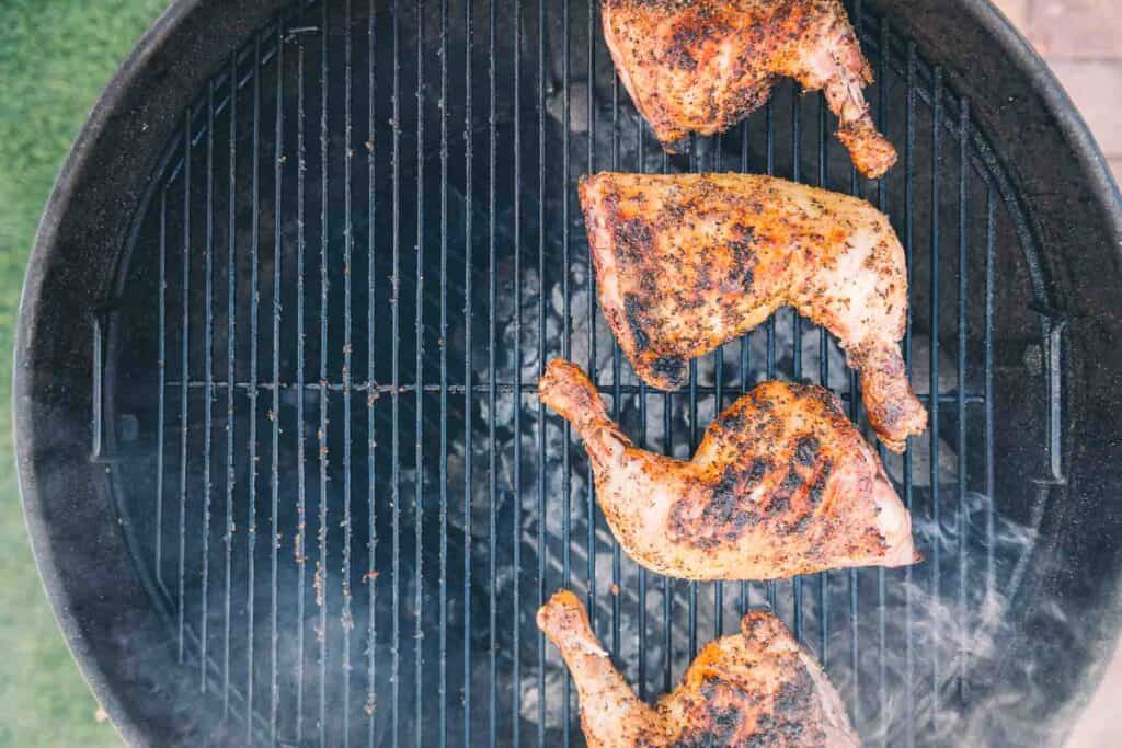 chicken legs on a grill.