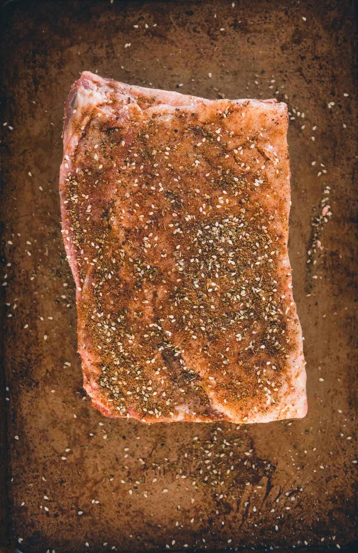 Lamb rubbed with spice blend.