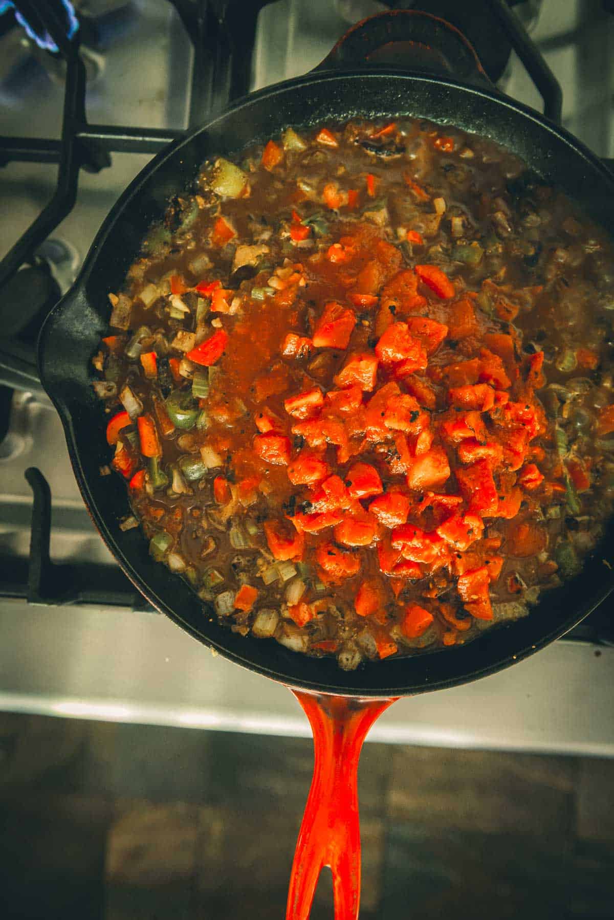 Tomatoes added to the cast iron skillet.