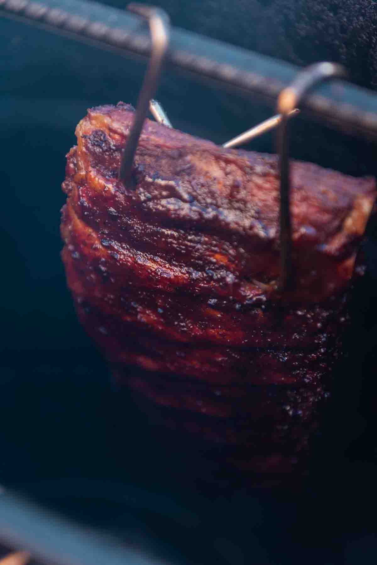 Ribs smoking in a Pit Barrel Coker. 
