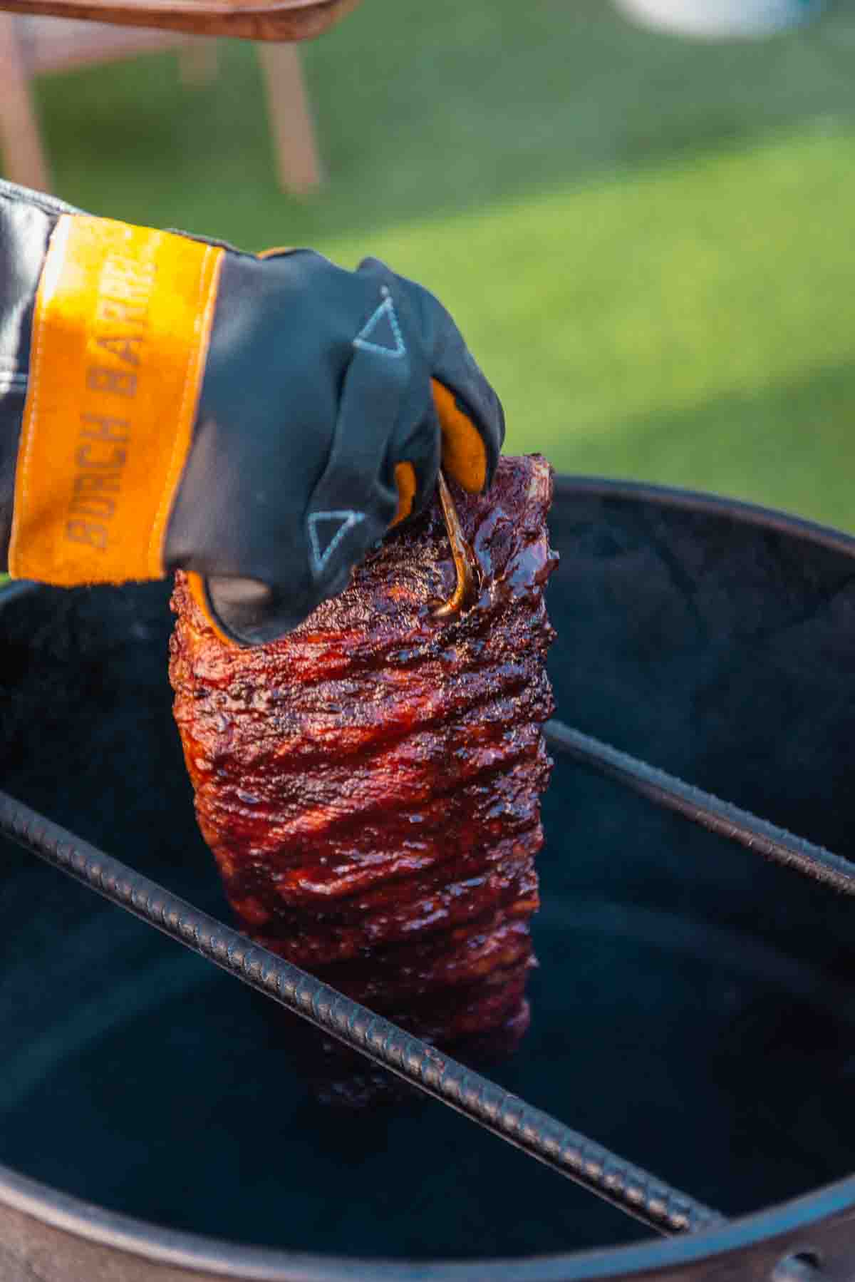 Sauced ribs coming out of the smoker. 
