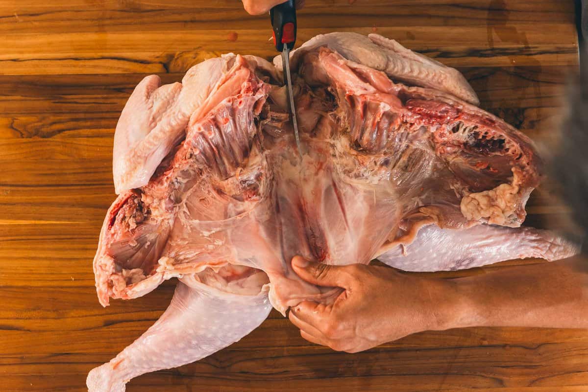 Sheets cutting through top of breastbone on turkey.