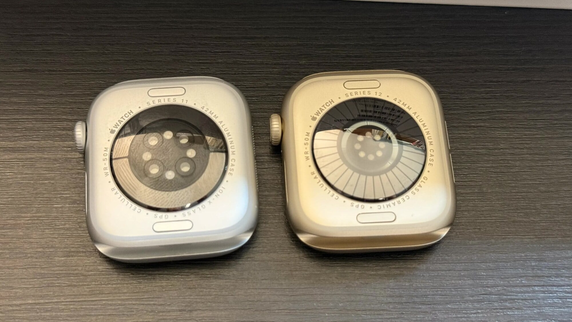 Backs of two Apple watches showing the different appearance of their sensors