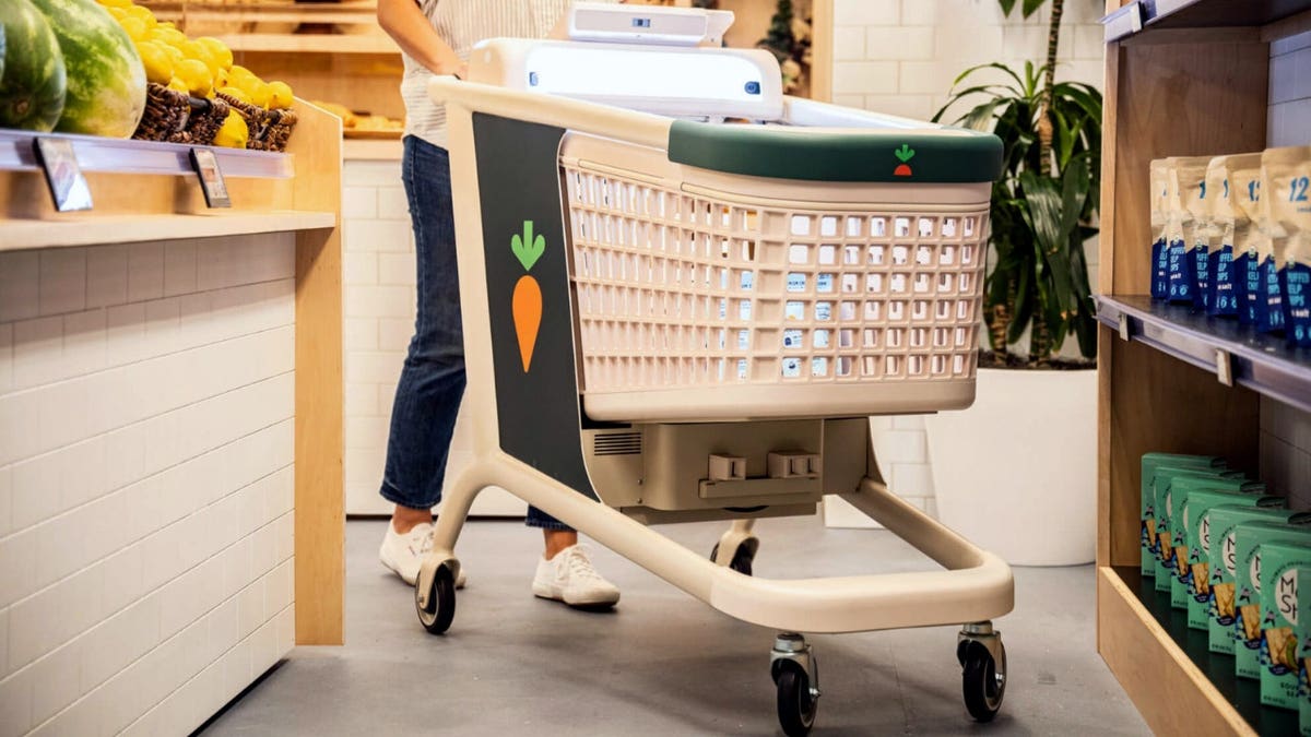 A shopper uses an Instacart Caper Cart.