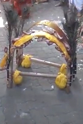 Kavadi with milk pots or honey carried on the shoulders after a vow of “vrata” or penance, singing praises of Muruga 