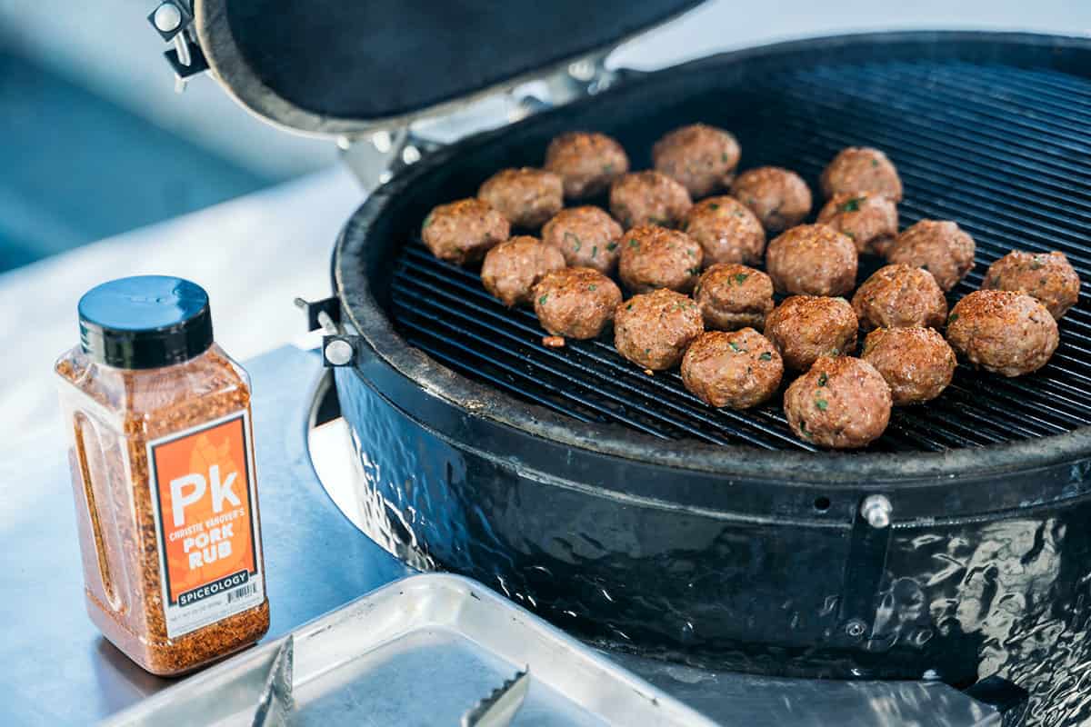 meatballs smoking on grill.