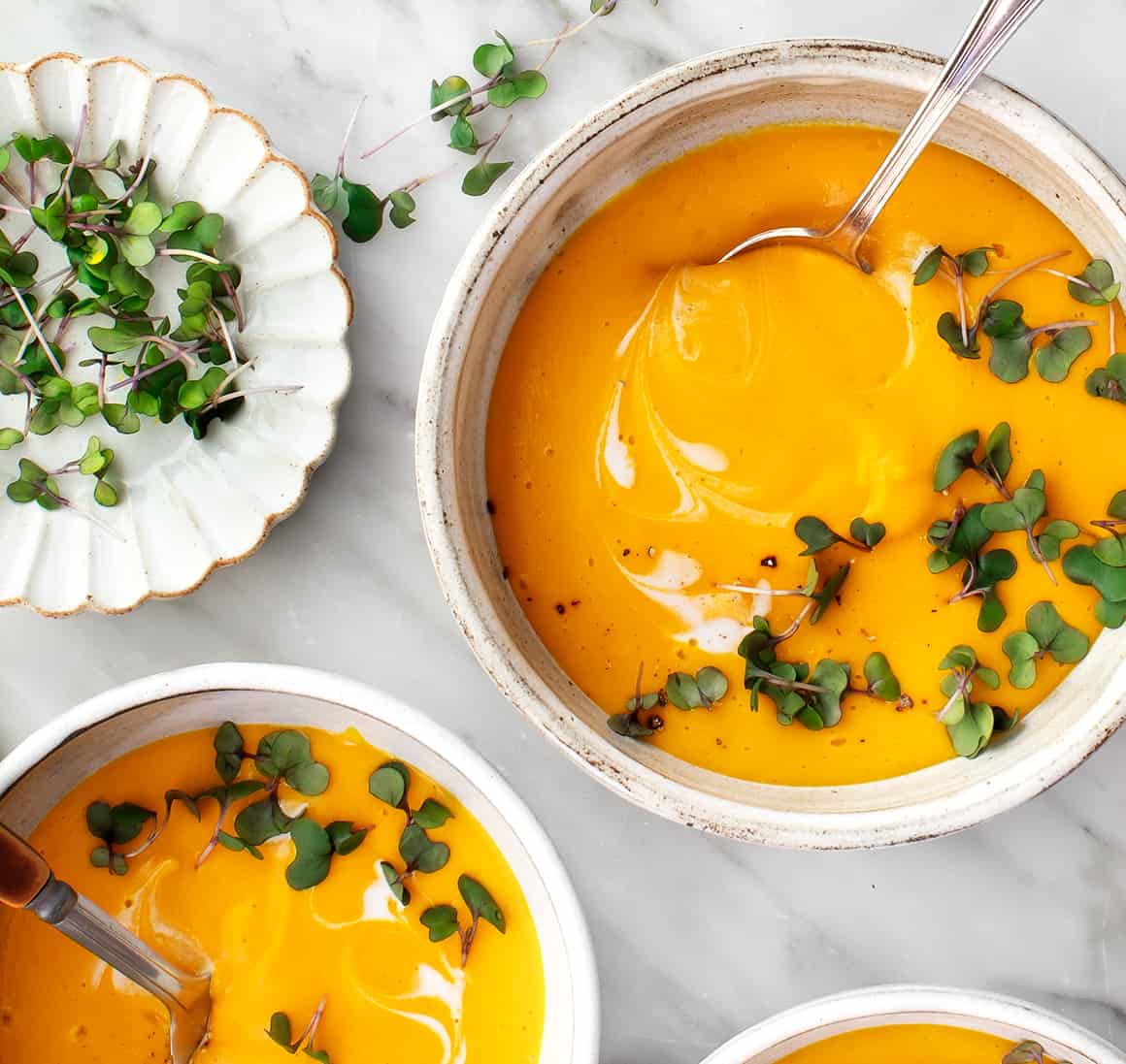 Creamy pumpkin soup in bowls