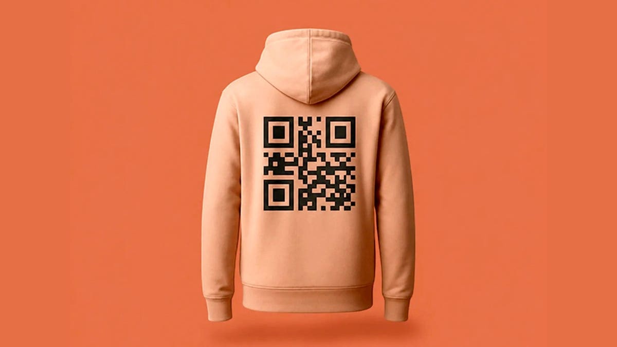 An orange hoodie with a QR code on the back.
