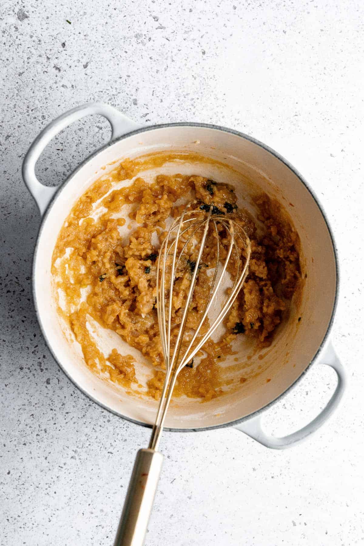 Showing the clumpy flour mixture of the roux. 