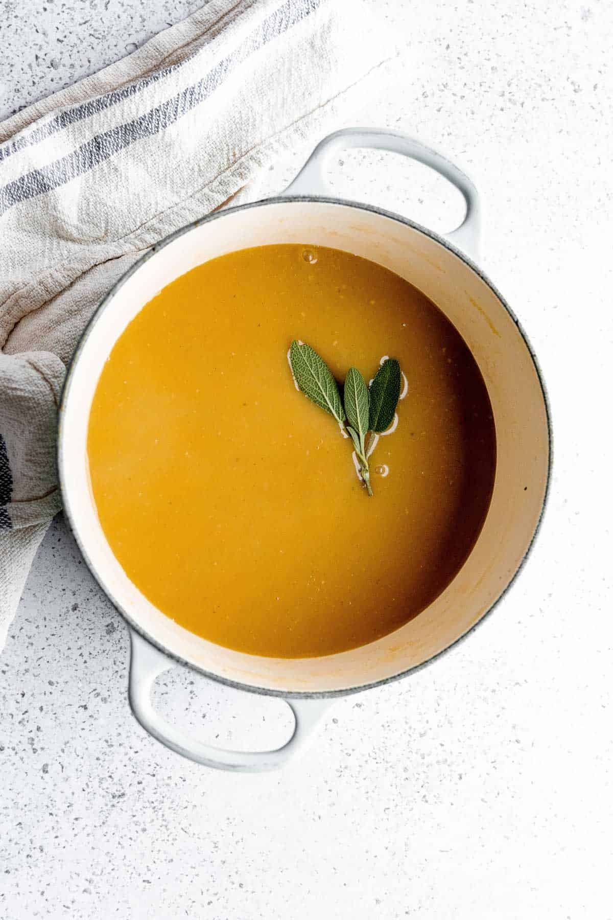 The finished smooth gravy in a pot with no clumps. 