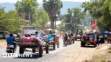 Thousands flee disputed border after deadly clashes and air strikes