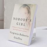 Nobody’s Girl: A Memoir of Surviving Abuse and Fighting for Justice Paperback