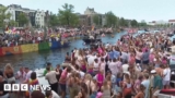 Crowds line Amsterdam’s canals for Pride boat parade