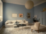 A small apartment with a sky-blue living room and a modern kitchen